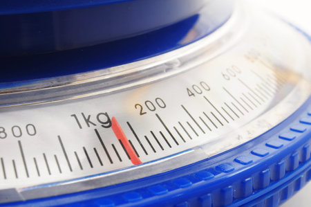 blue kitchen scales or balance showing cooking conceptの写真素材