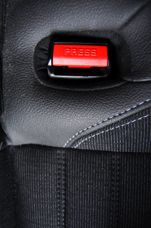 fasten your seat belt concept with red button and black copyspace