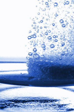 tablet or pain killer in a glass of water with copyspace