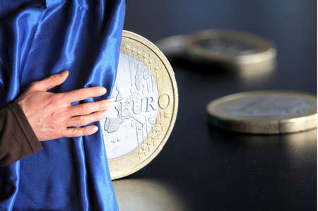 euro money concept with hand and blue curtain の写真素材