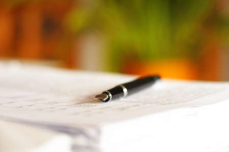 business desktop still life with folder pen copyspace and laptop in officeの写真素材