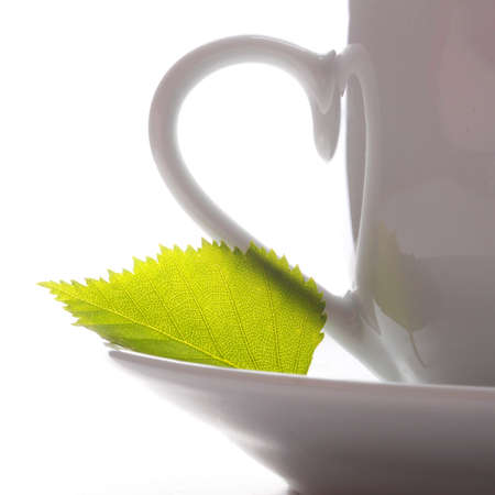 cup of tea or coffee with leaf and white copyspace の写真素材
