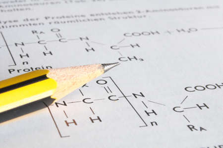 chemistry concept with pencil and formula in a education bookの写真素材