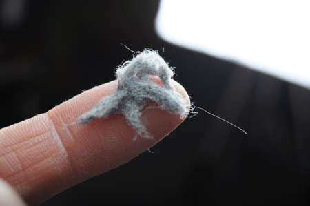 dust and finger showing cleaning concept with bokeh copyspaceの写真素材