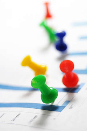 pin and business chart showing financial growthの写真素材