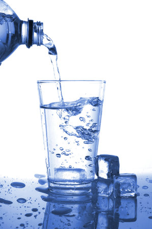 glass or cup of splashing water on white background                                    