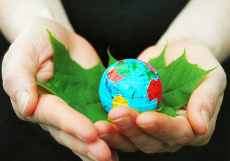 hand holding globe showing ecology or nature concept