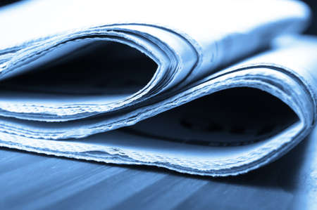 stack of newspaper on desktop showing news conceptの写真素材