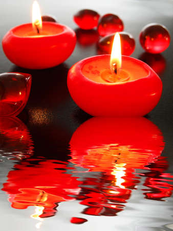 spa candle and water reflection showing zen conceptの写真素材