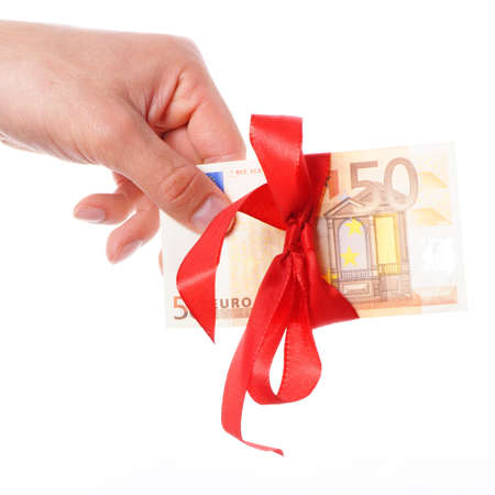 euro money with red ribbon showing gift conceptの写真素材