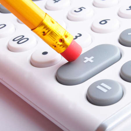 calculator showing business accounting concept in whiteの写真素材