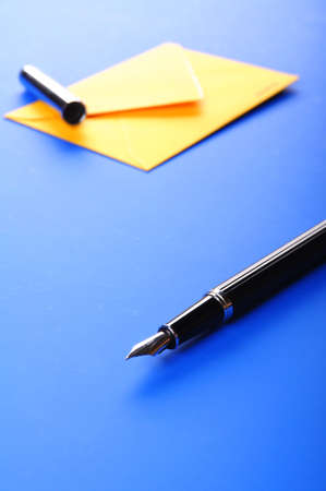 mail or email concept with envelope and penの写真素材