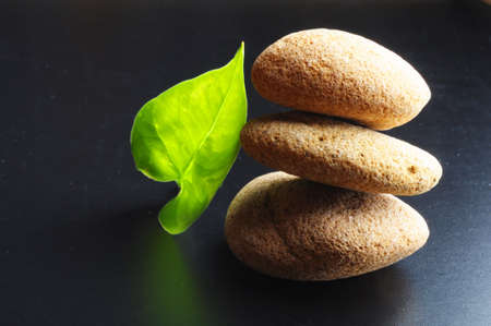zen stones on black background showing spa concept with copyspaceの写真素材