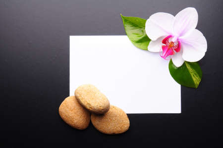 zen or spa stones with blank and empty copyspace paperの写真素材