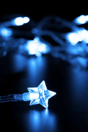 xmas or christmas holiday star lights with copyspaceの写真素材