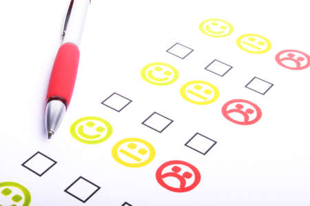 hand pen and checkbox or tickbox with smilieの写真素材