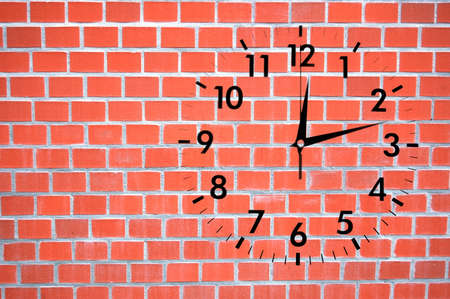 clock or watch on a wall with copyspace showing time conceptの写真素材