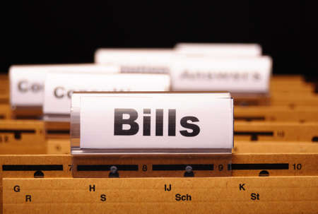 bill or bills word on paper riders showing payment or debts concept の写真素材