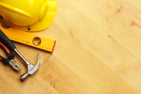 real estate concept with hard hat blueprints tools and copyspaceの写真素材