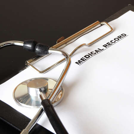 medical record clipboard and stethoscope showing health or medicine conceptの写真素材