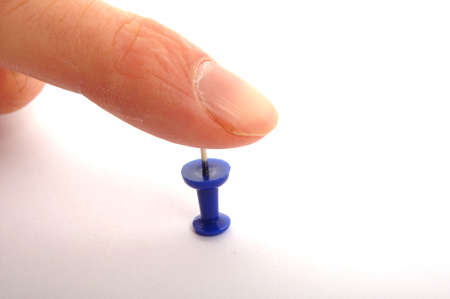 risk concept with finger over risky pinの写真素材