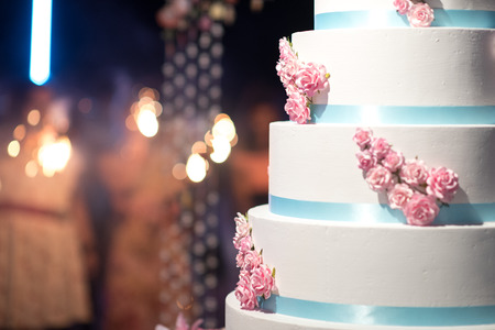Close up at Cake for party and firework background to anniversary cakes and other festivities. Fire cracks blurred backgroundの写真素材