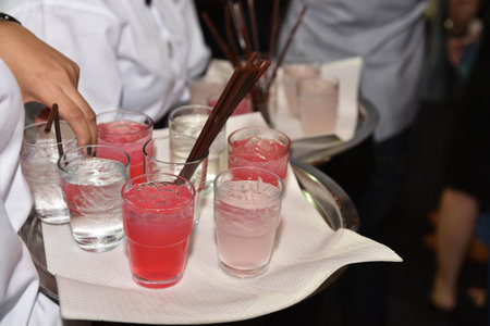 Barman show. Bartender is making cocktail at night club. Close up shot of bartender hands preparing...