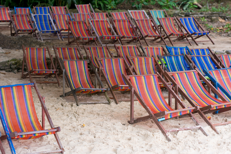 Deck Chair on Beach outdoor in Ocean Travel Thailand. Colorful plastic on wooden structure Beach chairs for tourist in happy holiday.の写真素材