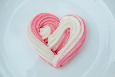 Valentine concept Dessert : Heart meringues design by sugar in heart shape on plate for Homemade love in Valentine's Day Decorationの写真素材