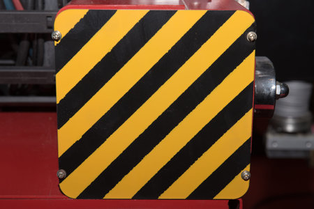textured striped warning sign for safety in factory or dangerous zone.