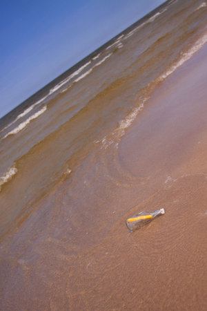 Beach compositions. Botlle brought by the water
