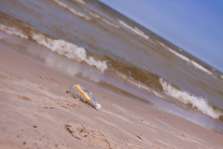 Beach compositions. Botlle brought by the water