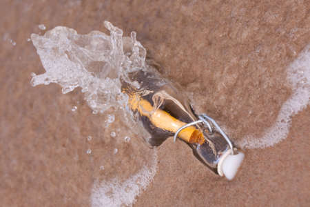 Beach compositions. Botlle brought by the waterの写真素材