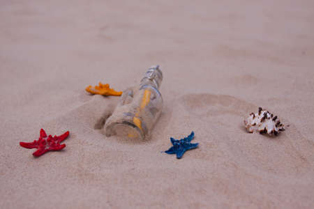 Beach compositions. Botlle brought by the waterの写真素材