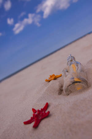Beach compositions. Botlle brought by the waterの写真素材
