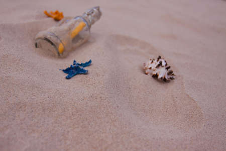 Beach compositions. Botlle brought by the waterの写真素材