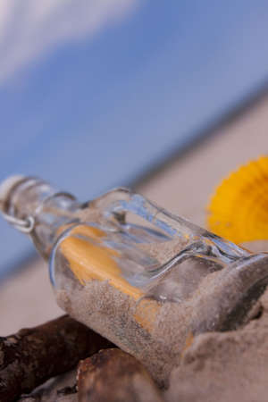 Beach compositions. Botlle brought by the waterの写真素材