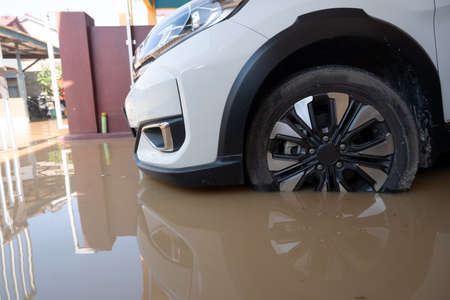 natural disasters flood limited to car tires in the garageの写真素材