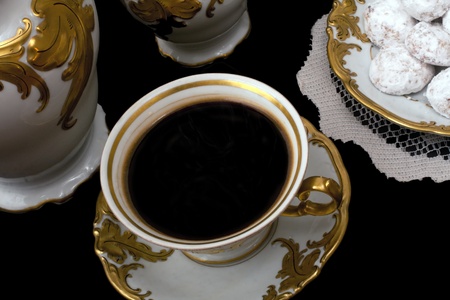 Setting of a  cup of Coffee in antique porcelain with cookiesの写真素材