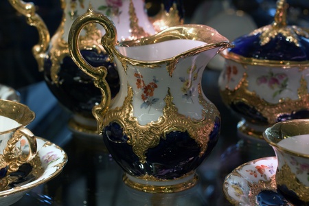 Antique porcelain coffee set in a show windowの写真素材