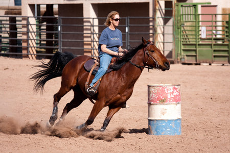 Women horse barrel race in corral in las vegasのeditorial素材