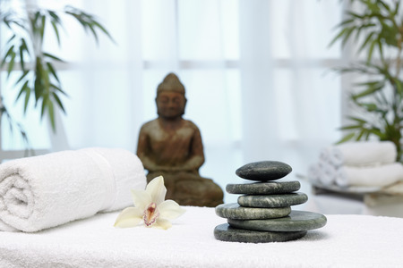 Bhudda and hot stone massage bedの写真素材