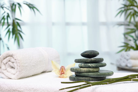 Massage table with hot stonesの写真素材