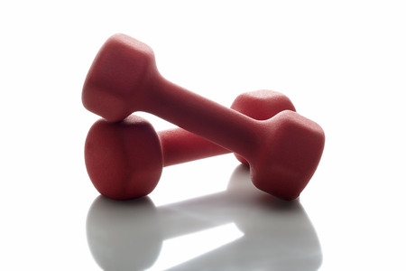 Red Dumbbells on a white backgroundの写真素材
