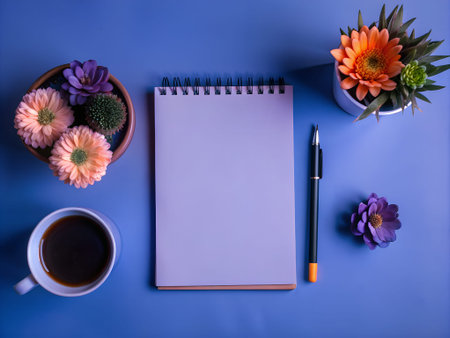 A spiral notepad with a blank white page is open in the center of the frame.pen_spark