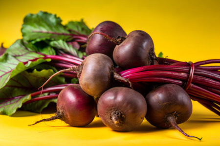 Close-up image of a fresh group of organic beets with green leaves