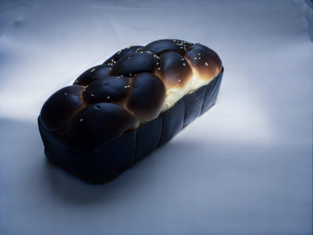 A freshly baked challah loaf, golden brown and glistening. Perfect for Shabbat or any special...