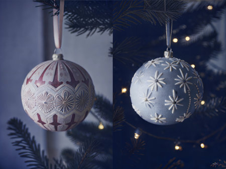 Detailed view of colorful ornaments hanging on a Christmas tree.の写真素材