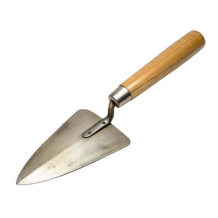 A well-worn trowel with a wooden handle, showing signs of use and age. Isolated on black background.