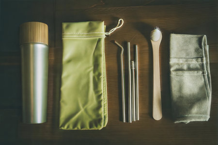 Sustainable bamboo water bottle, reusable straws, and cleaning cloth. Perfect for eco-conscious travel.の写真素材